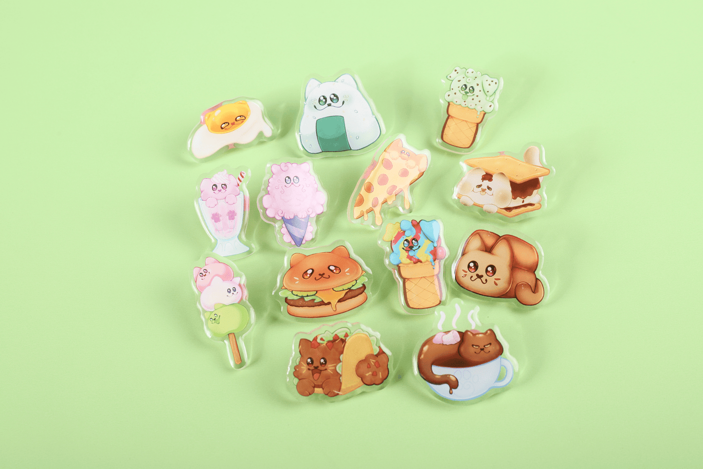 Set of 13 adorable acrylic cat food pins featuring designs such as Burger Cat, Taco Cat, Hot Cocoa Cat, Bread Loaf Cat, Dango Cat, Milkshake Cat, Cotton Candy Cat, Onigiri Cat, Egg Cat, S'mores Cat, and Pupcone.